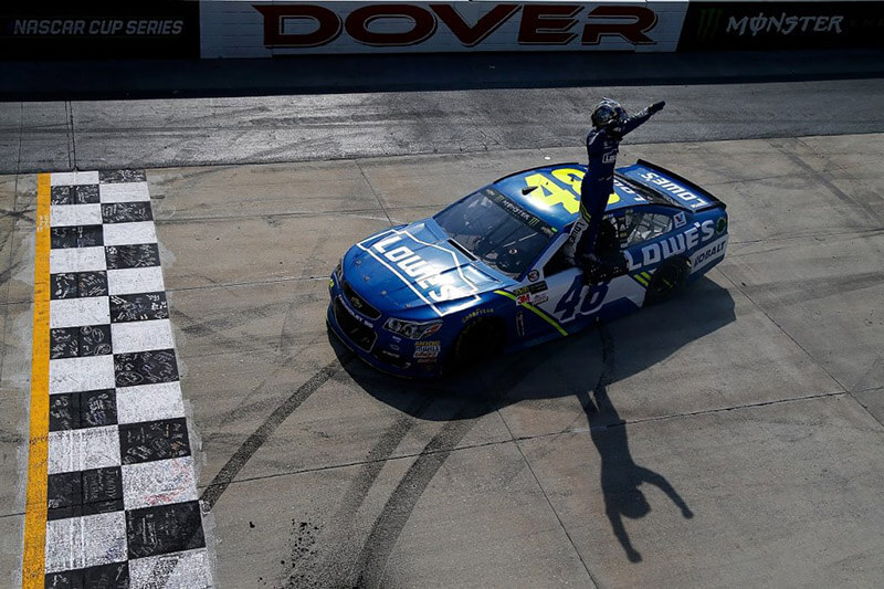 Jimmie Johnson celebrates after winning the NASCAR Cup Series AAA 400 Drive for Autism at Dover Motor Speedway on June 4, 2017 | Sean Gardner/Getty Images